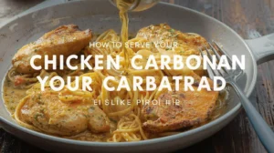 Chicken carbonara served with creamy sauce, spaghetti, and garnished with fresh herbs in a bowl, ready to eat.