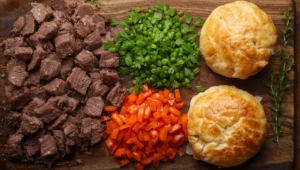 Beef stew meat, diced carrots, fresh herbs, and golden crust for the perfect beef pot pie recipe.