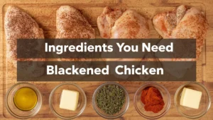 Fresh chicken breasts, smoked paprika, cayenne, garlic powder, oregano, thyme, butter and olive oil on a wooden board – blackened chicken ingredients
